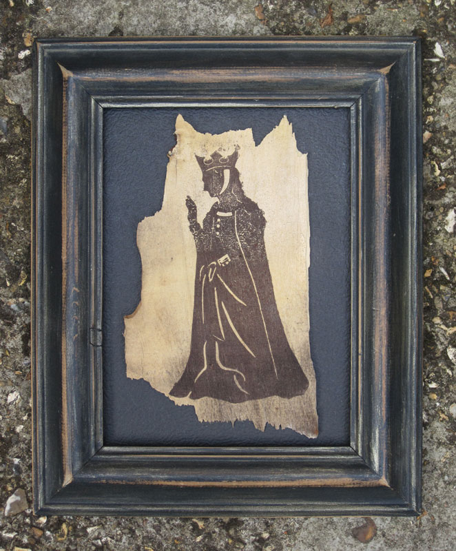 Silhouette of Empress Matilda on a fragment of wood