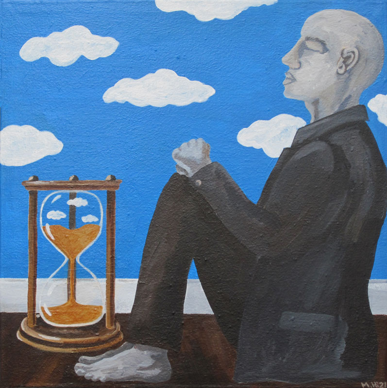 Man sitting with hourglass